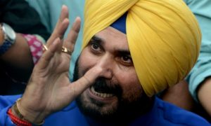 Former Indian cricketer and former member of parliament Navjot Singh Sidhu addresses the media outside his residence in New Delhi on July 25, 2016. Sidhu's resignation as a Bharatiya Janata Party (BJP) MP has kickstarted speculation he is moving to the Aam Aadmi Party (AAP), which is rising in popularity in Punjab ahead of general elections. / AFP PHOTO / MONEY SHARMA
