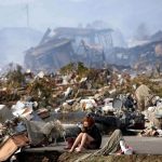 a-japanese-woman-cries-after-earthquake-and-tsunami-struck-japan-in-march-2011