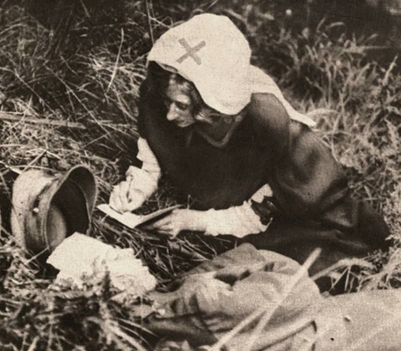 a-red-cross-nurse-writes-the-last-words-of-a-british-soldier-during-wwi