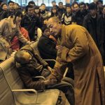 a-monk-prays-for-an-old-man-who-died-while-waiting-for-a-train-in-china