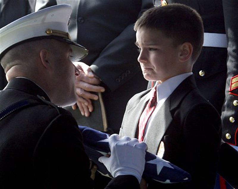 marine-staff-sgt-marc-golczynskis-son-accepts-the-flag-for-his-father-during-a-memorial-service-he-was-shot-a-few-weeks-before-he-was-due-to-return-home