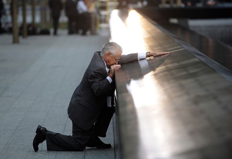 robert-peraza-falls-to-his-knees-as-he-touches-his-sons-name-at-the-911-memorial