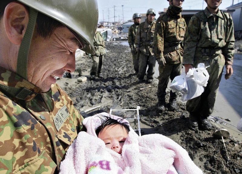 soldiers-rescue-a-4-month-old-baby-girl-who-went-missing-for-4-days-after-the-japanese-tsunami-in-march-2011